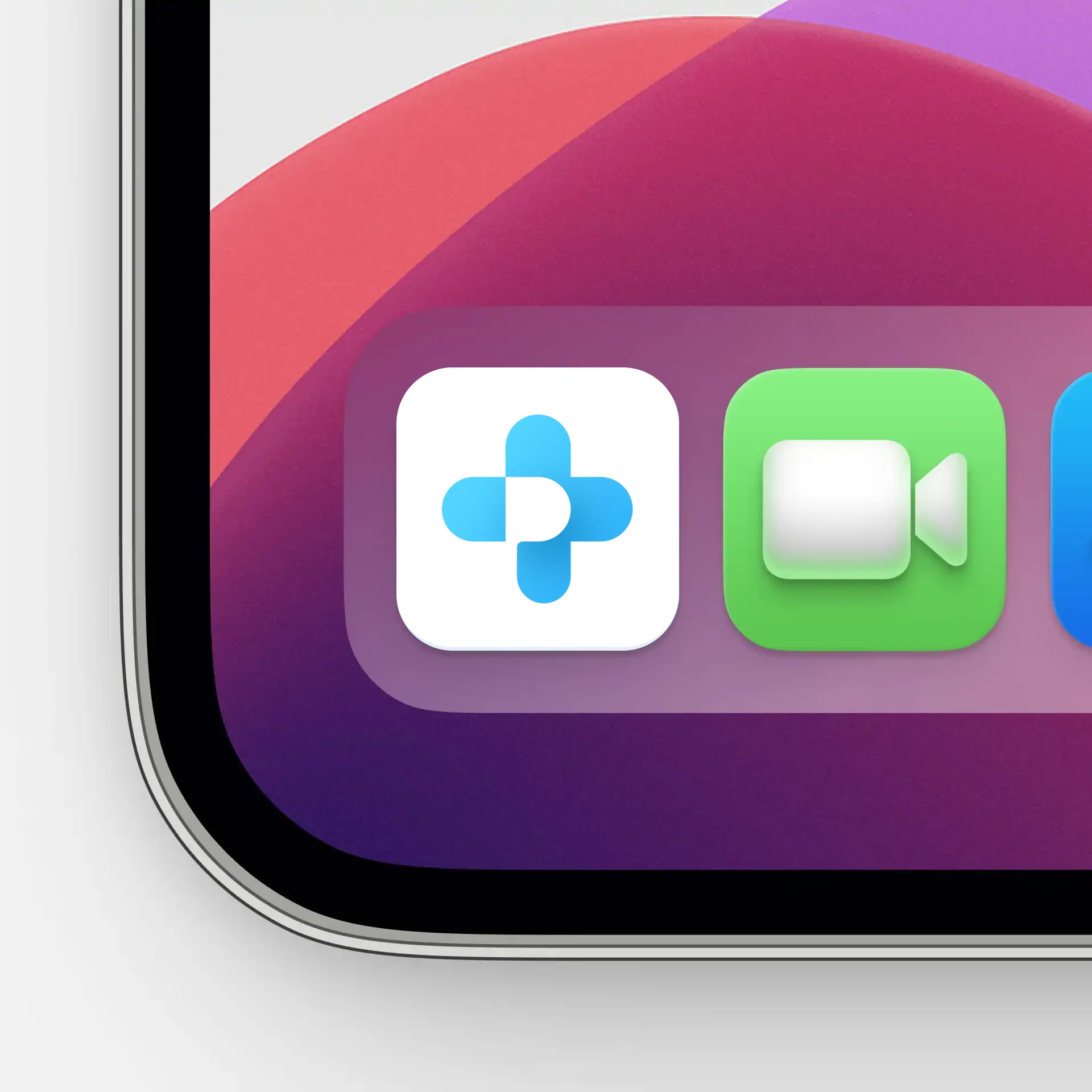 Blue cross-shaped health app icon in an iPad dock next to FaceTime
